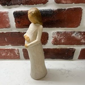 Willow Tree Hand painted resin figure in cream dress with both hands on belly.